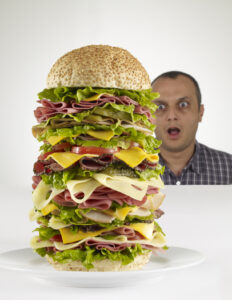 Man staring at a giant burger