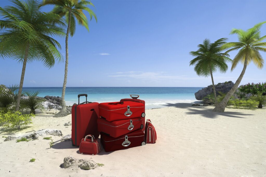 Suitcase on beach, ready for vacay