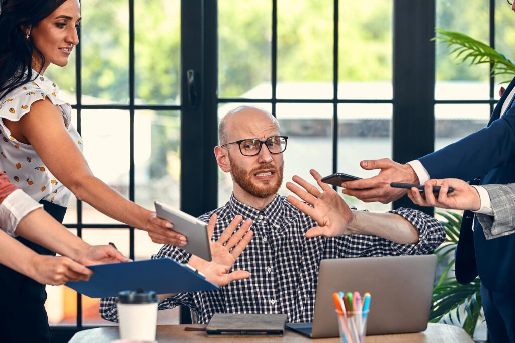 Man in office too many tasks, freaking out a bit