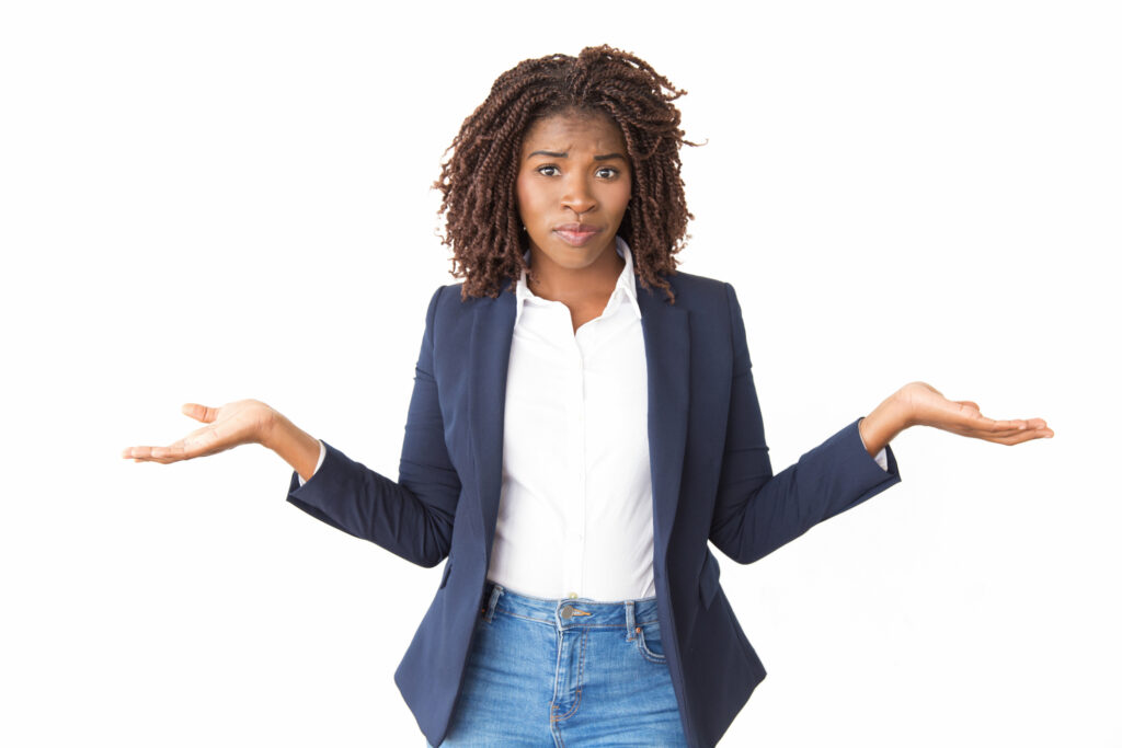 Upset puzzled businesswoman making do not know gesture